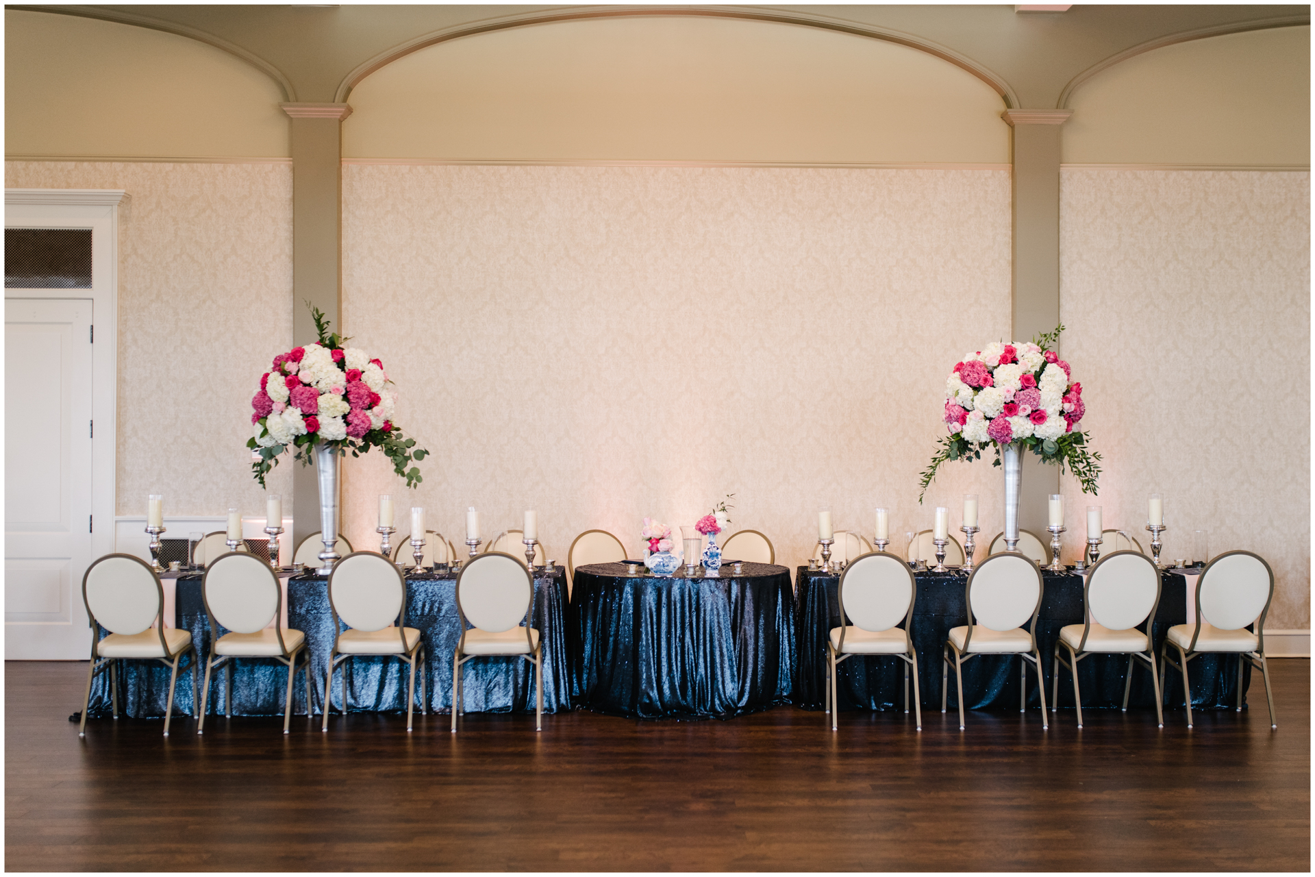 Blue sequence table cloth - pink and white floral centerpieces - bridal party table - baron bluff
