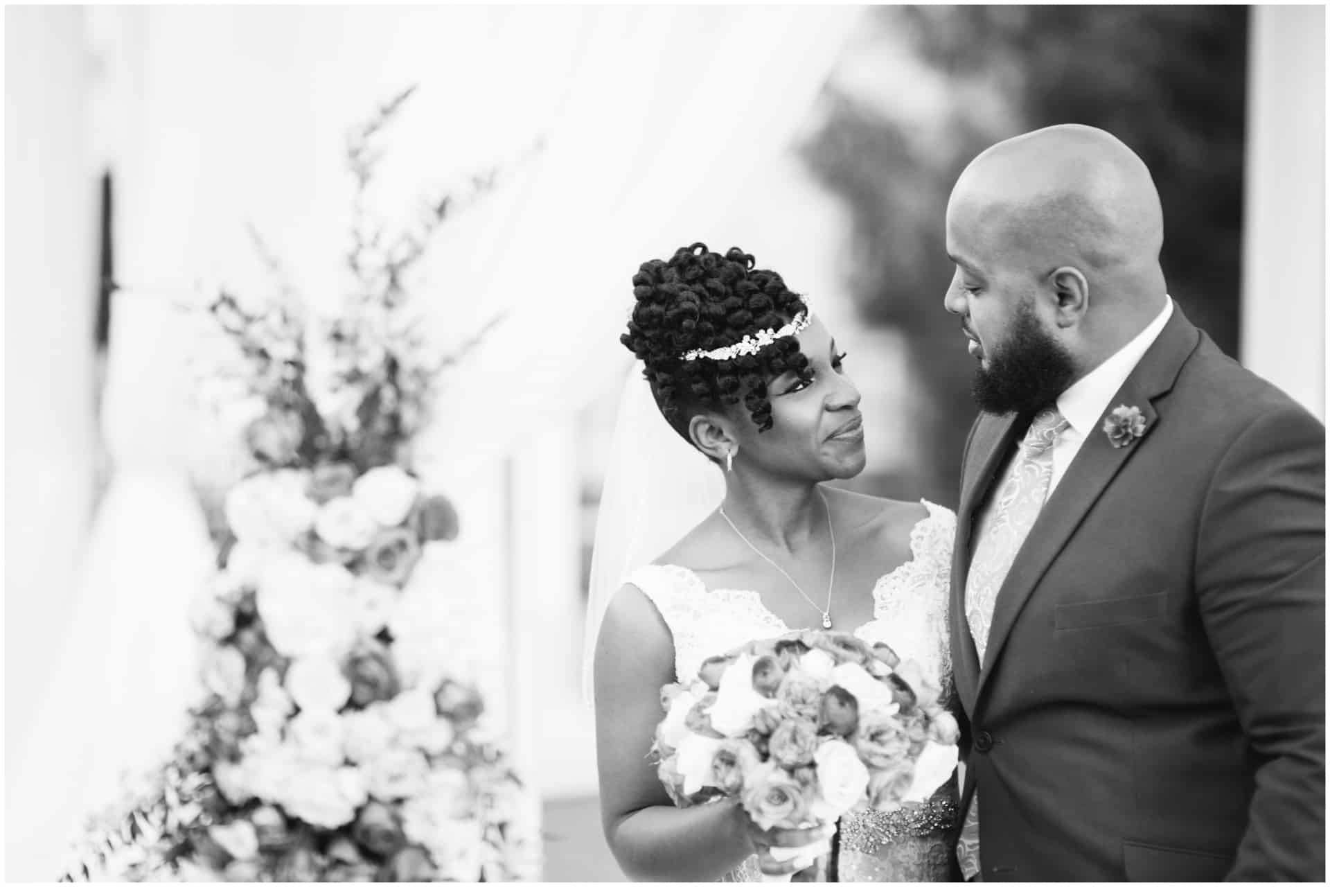 Candid black and white image of the bride and groom