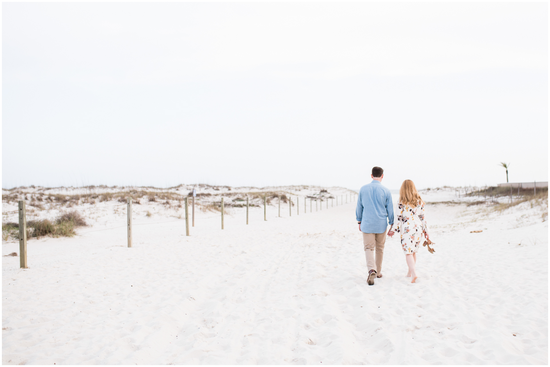 Couple walking in the sand holding flip flops - Gulf Shores Engagement 