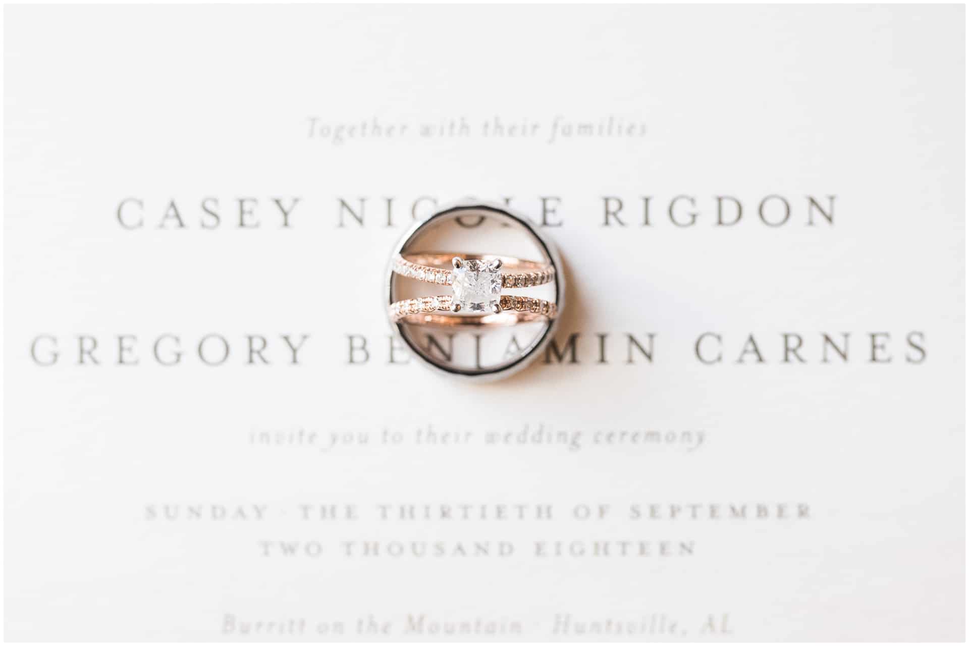 huntsville Alabama wedding - engagement ring and wedding bands on wedding invitation