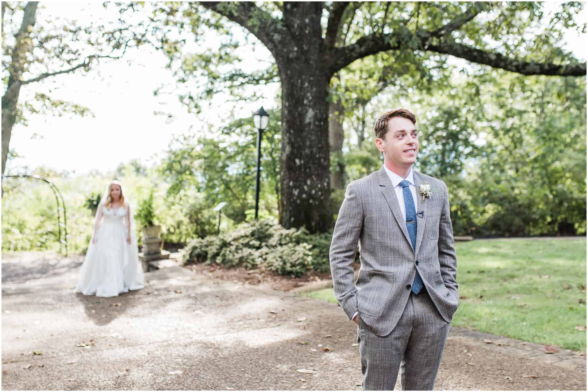 first look at burritt museum wedding Huntsville Alabama under large oak tree