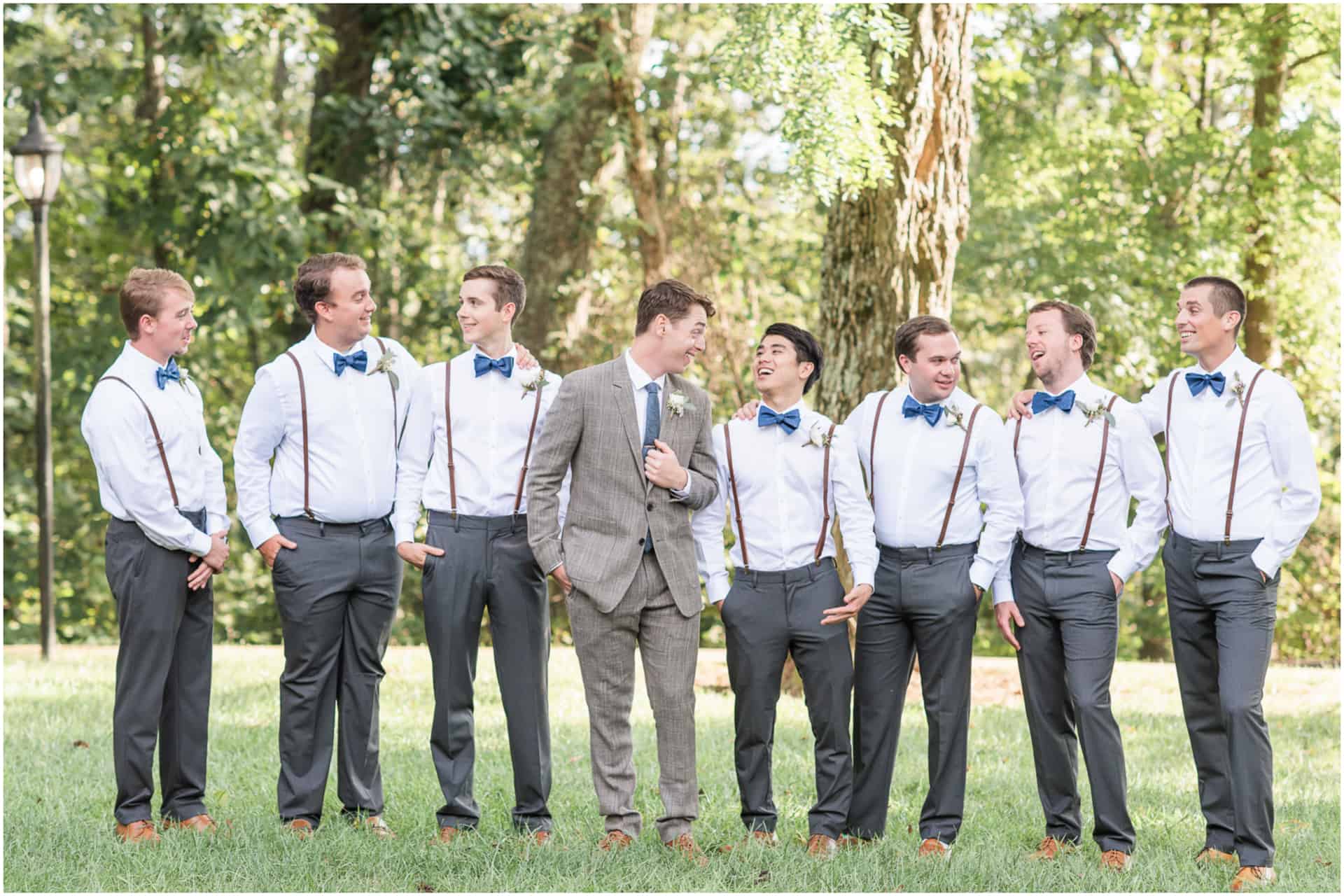 groom and groomsmen brown suit and suspenders outdoor portraits
