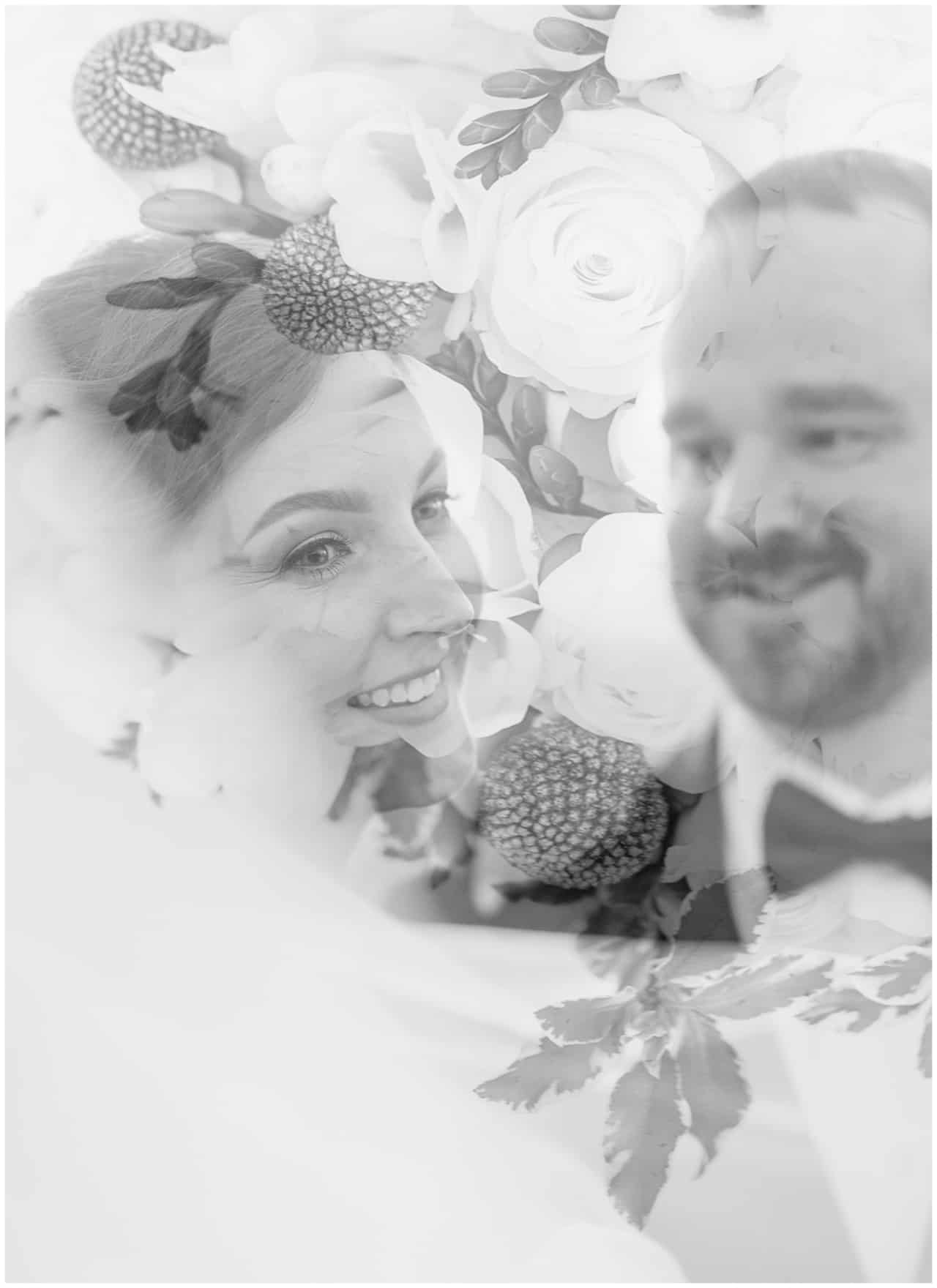 Black and white double exposure of bride and groom with flowers