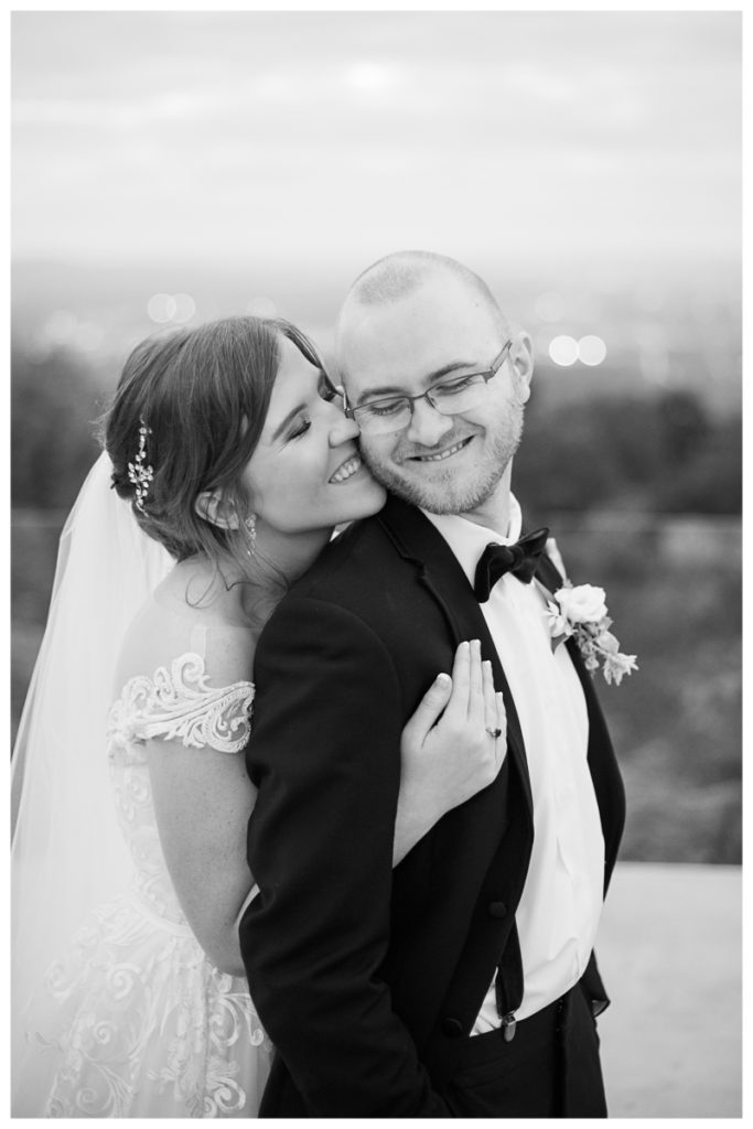 Burritt on the Mountain Wedding Black and White Image of bride kissing groom on the cheek
