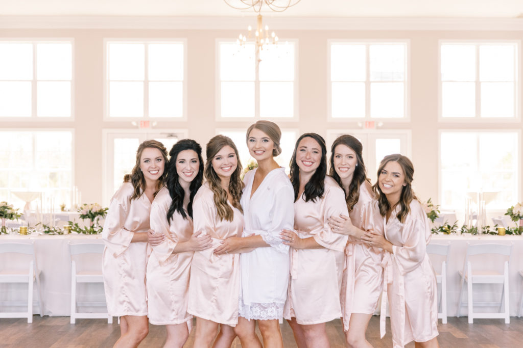 Getting Ready for the Wedding - Bridesmaids in matching blush pink robes