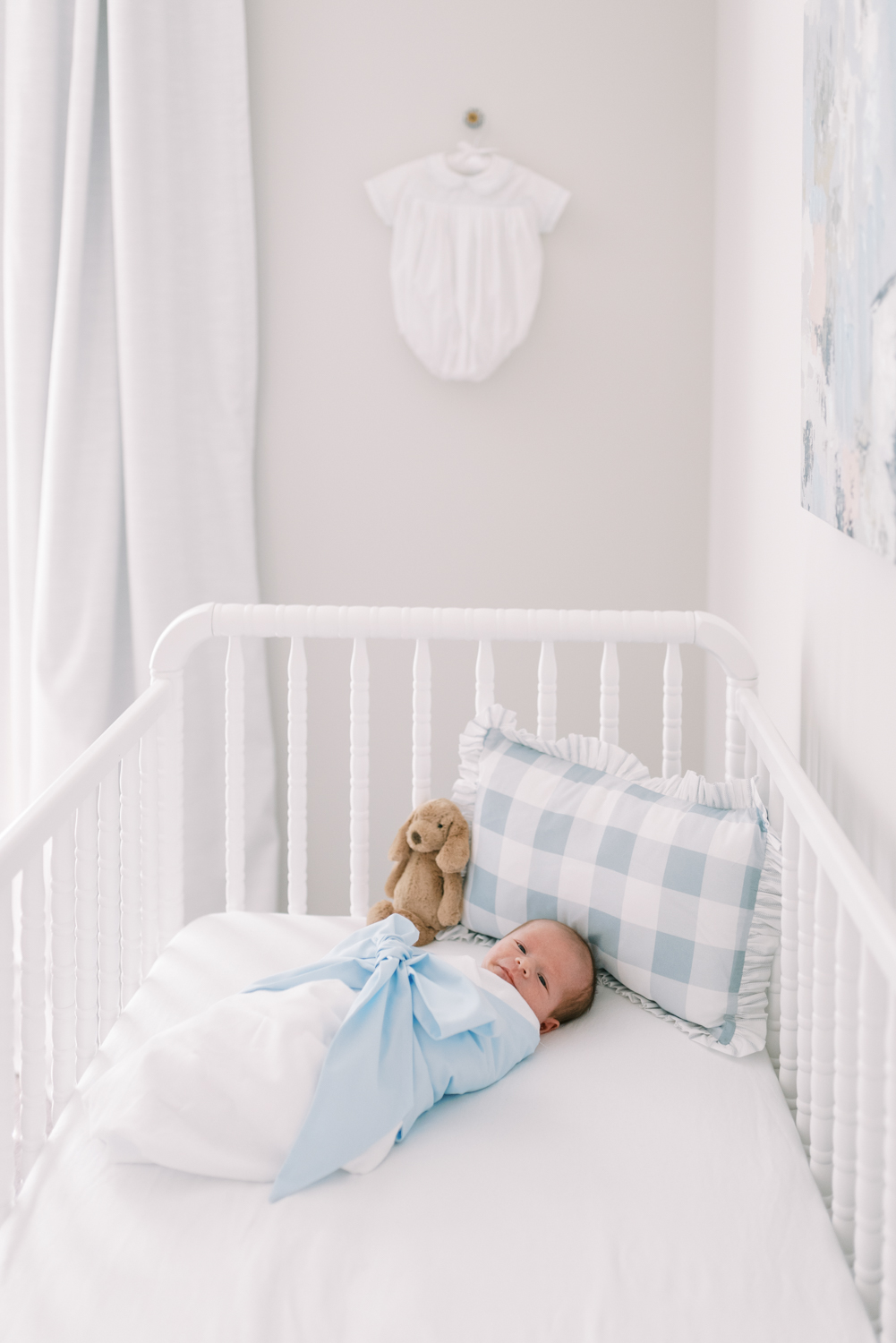 Lifestyle Newborn Session Preparation Guide - Baby boy laying in crib - White nursery