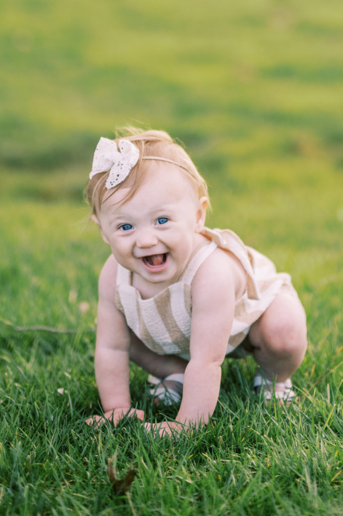 One Year Old Girl Photography Session in a Brown and White Romper from the Little Cotton Shoppe
